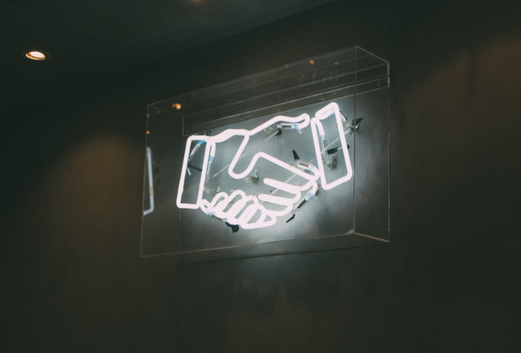 Fluorescent handshake - Partner marketing