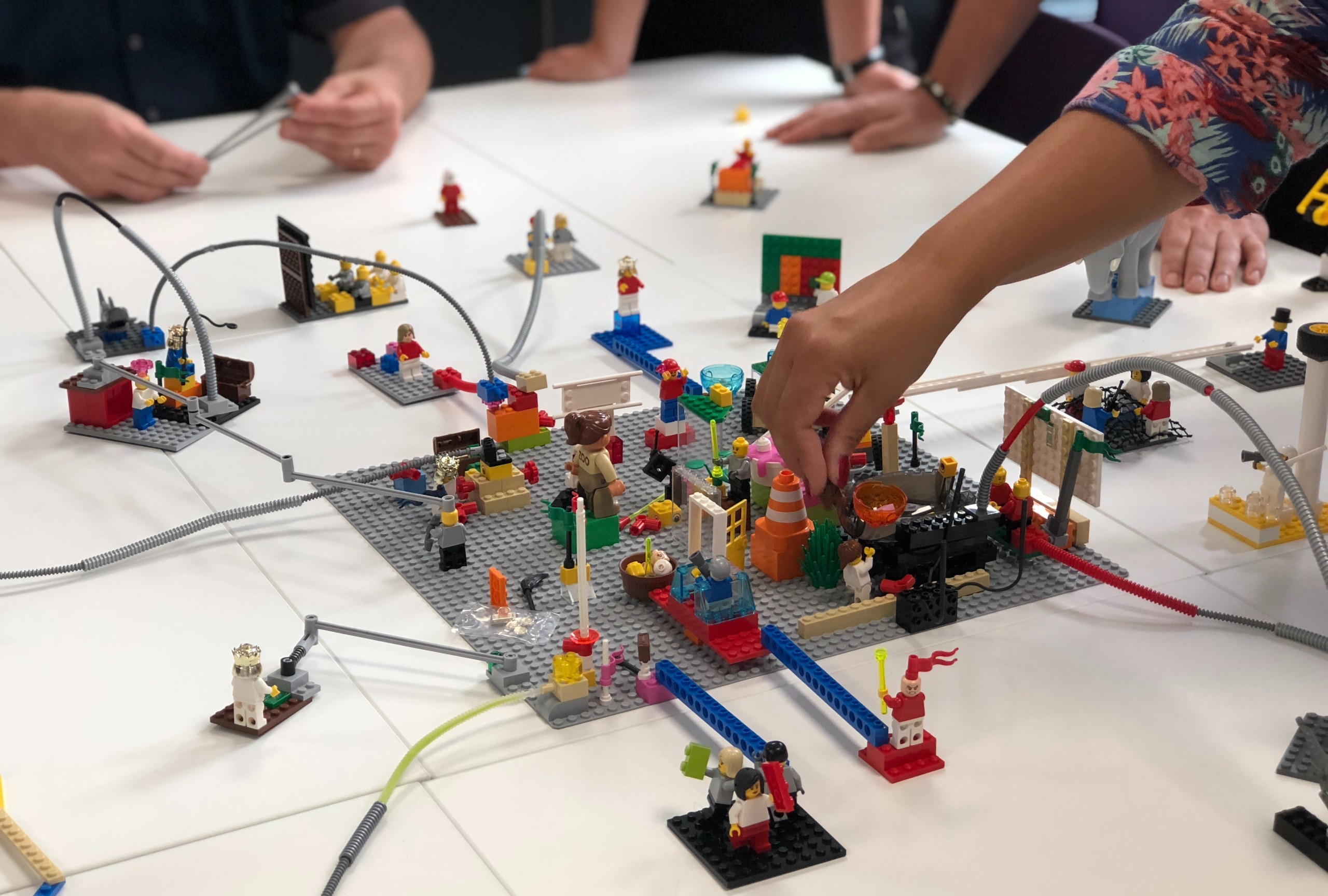 a group building lego which is an example of design democratization