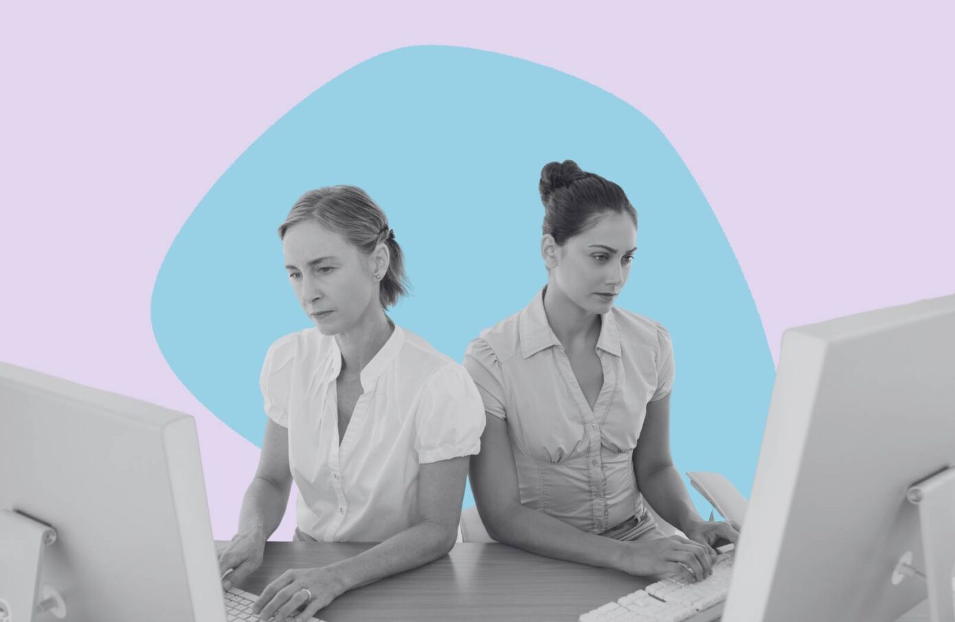 two women working side by side a computers