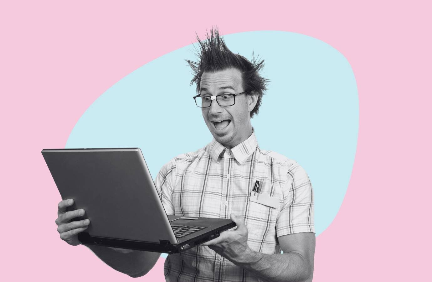 man looking excitedly at a computer